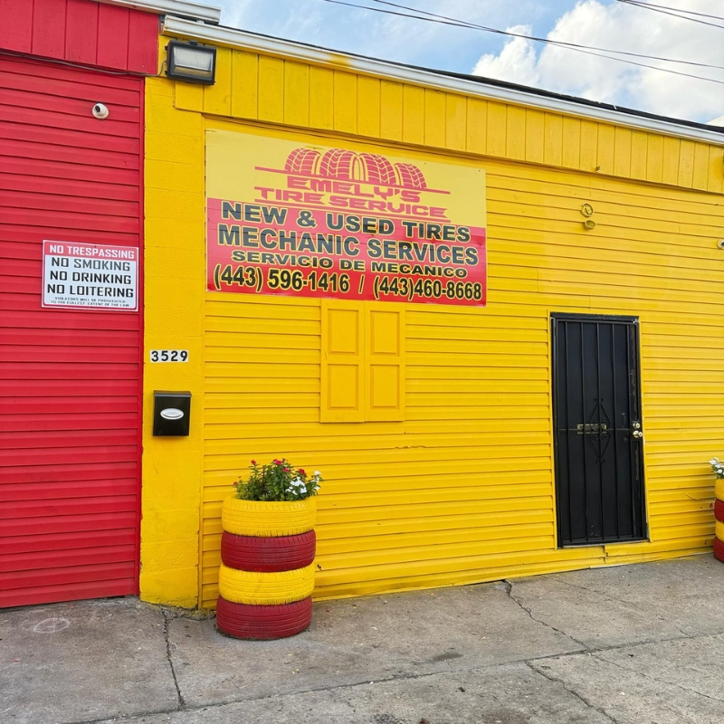 Emely's Tire Service Hanover St entrance with New & Used Tires and Mechanic Services sign