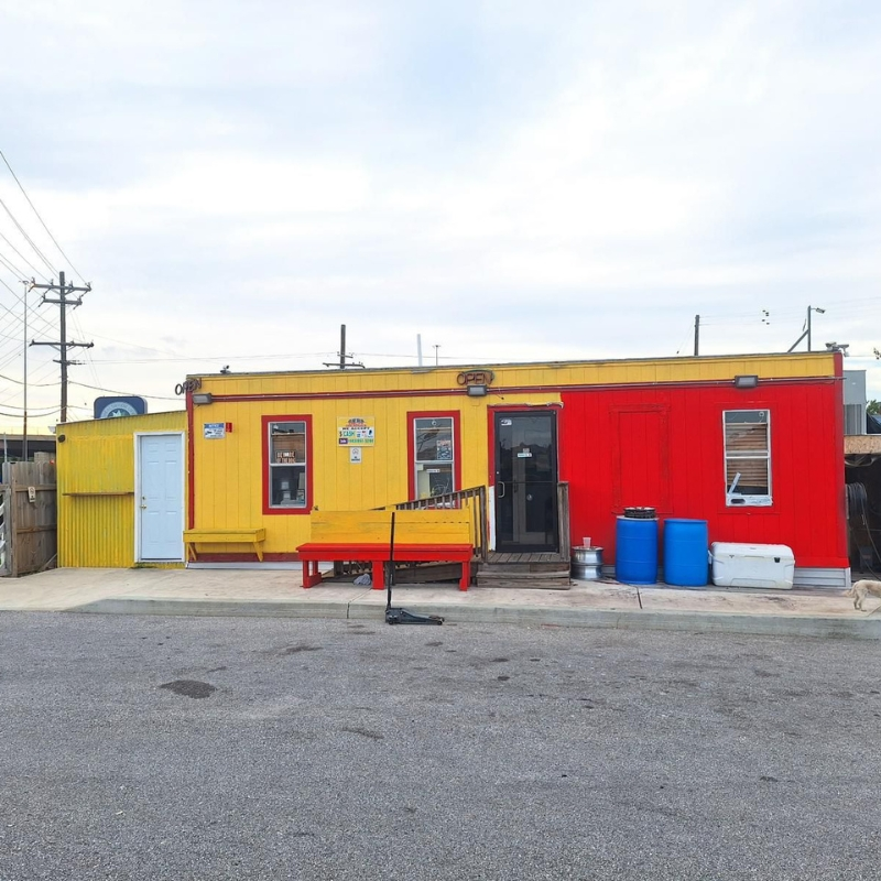 Emely's Tire Service North Point Blvd storefront with red and yellow exterior